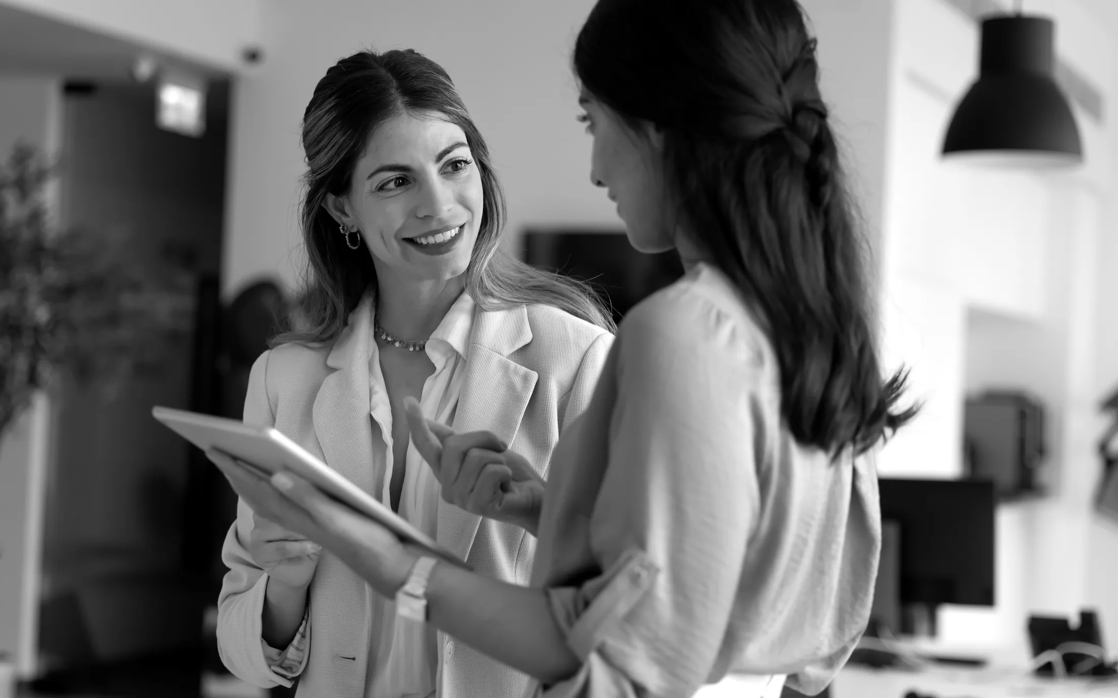 Black-and-white care coordinator supporting a provider
