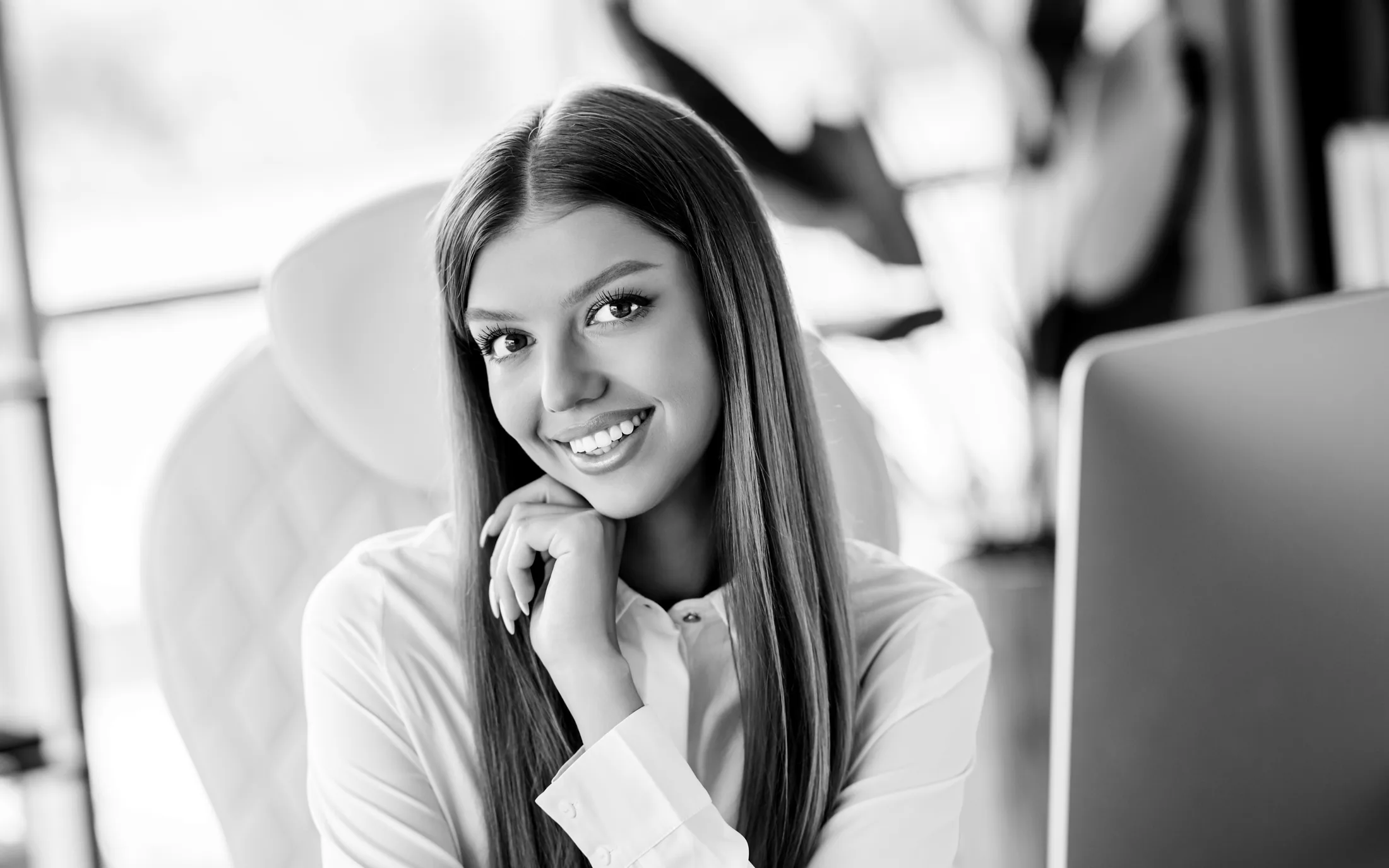 Black-and-white dental phone support specialist on a headset
